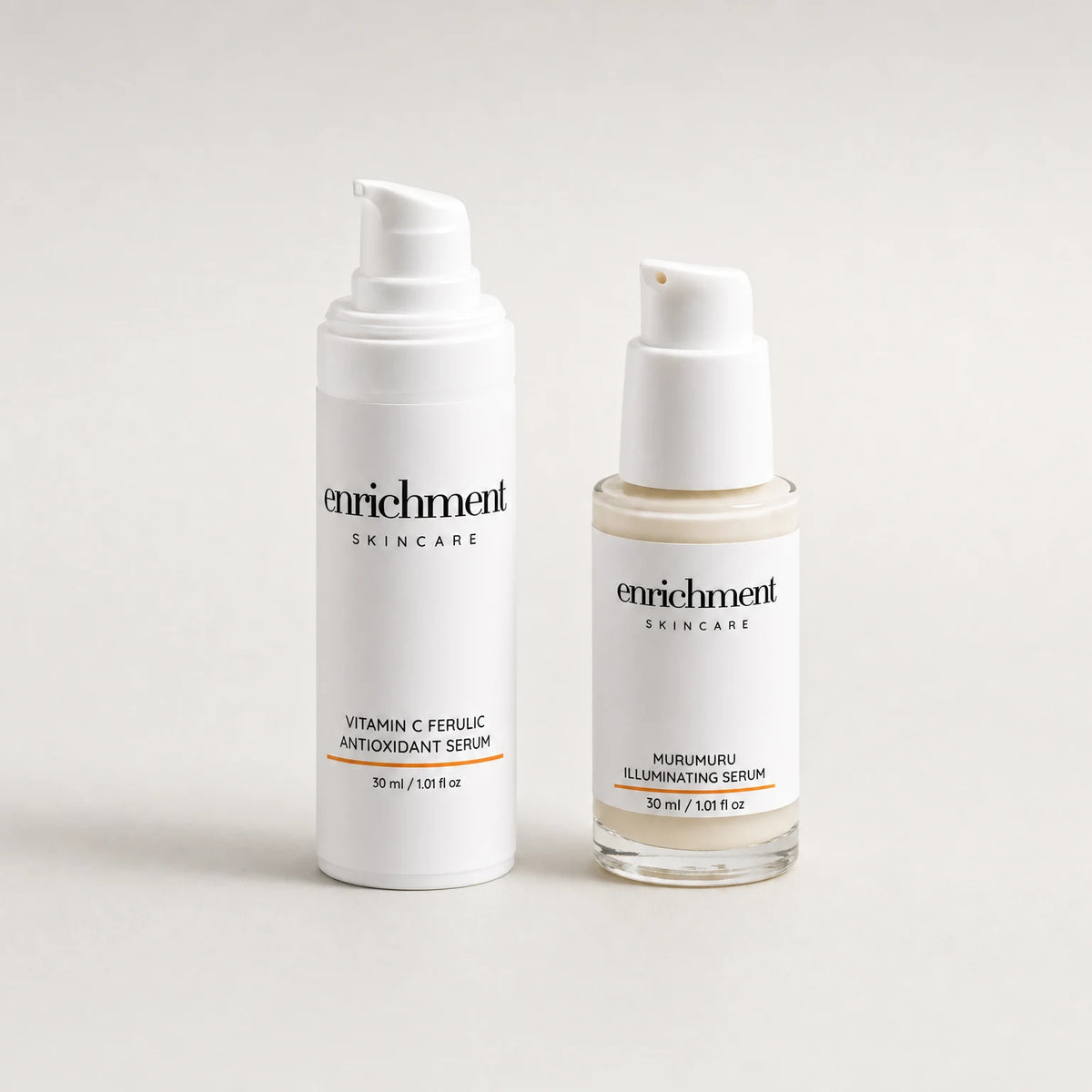 The Vitamin C Ferulic Antioxidant Serum and the Murumuru Illuminating Serum standing side by side