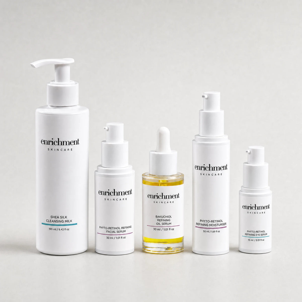 Five Enrichment Skincare products in a row: Shea Silk Cleansing Milk, Phyto-Retinol Refining Facial Serum, Bakuchiol Refining Oil Serum, Phyto-Retinol Refining Moisturiser and Phyto-Retinol Refining Eye Serum