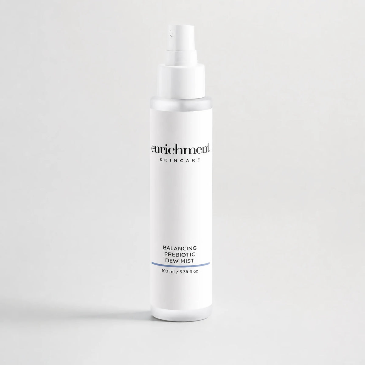 Enrichment Balancing Prebiotic Dew Mist bottle with the enrichment SKINCARE wordmark and 100 ml / 3.38 fl oz volume line centred on the label