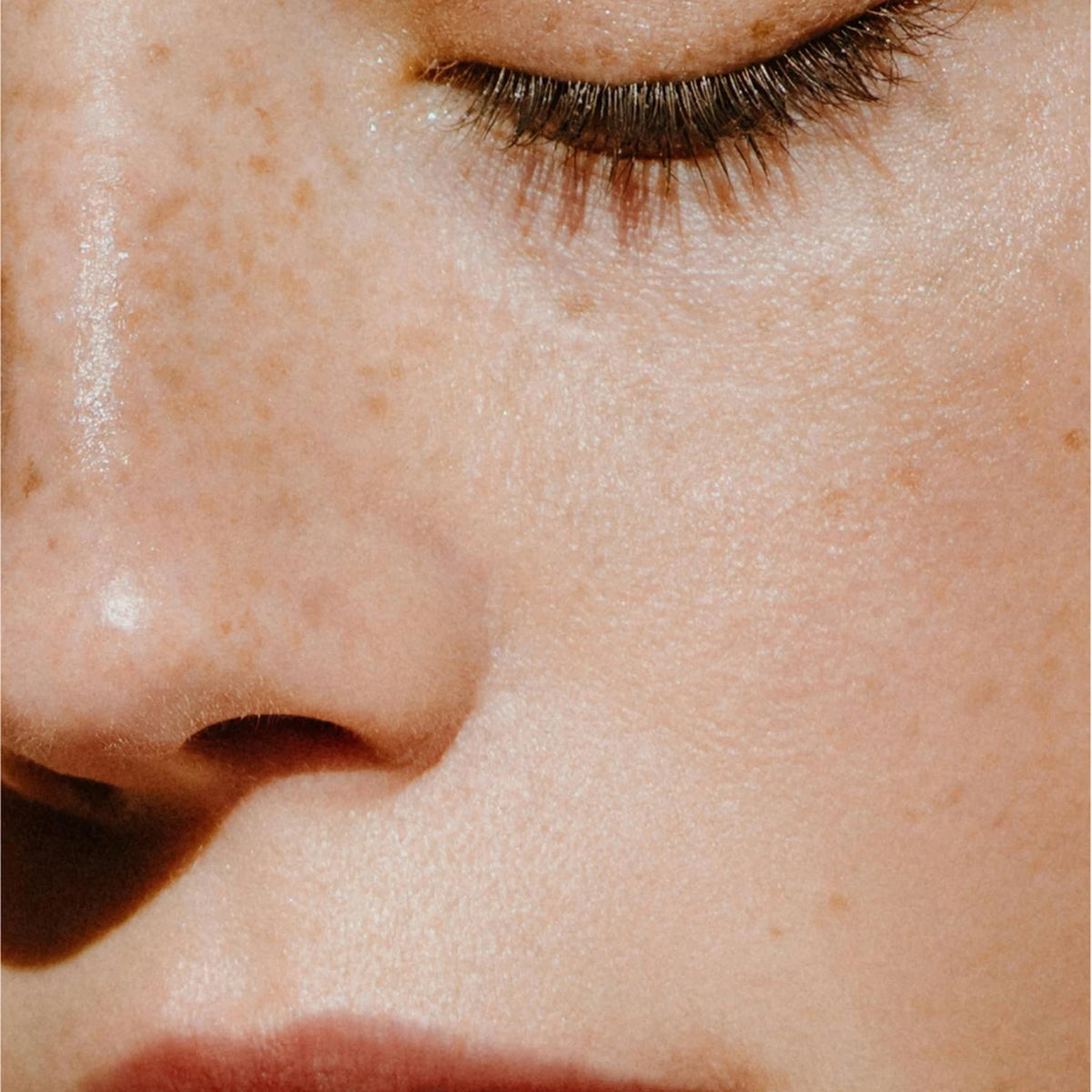 Close-up of a person's face in soft light