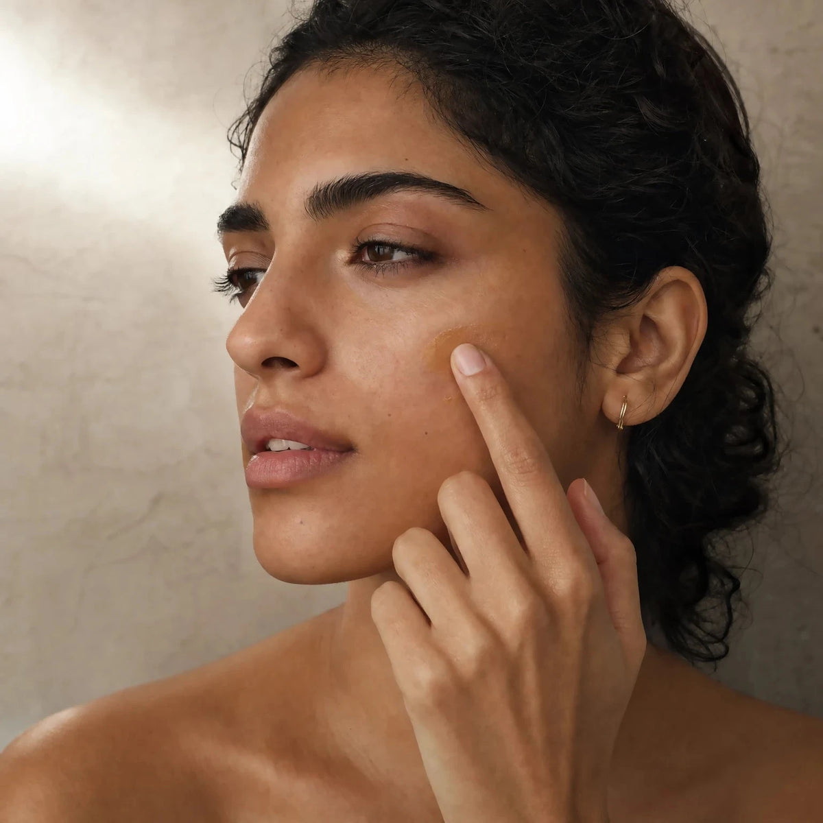 Applying Mineral Sun Stick SPF50 Tinted