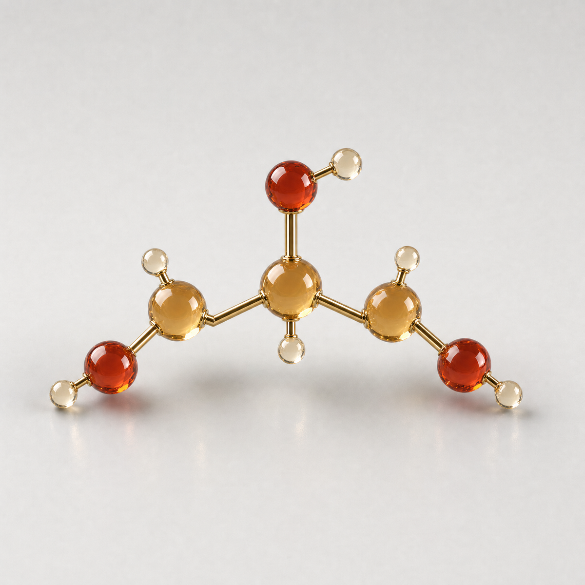 A glass ball-and-stick model of a glycerol molecule with three carbons and three hydroxyl groups