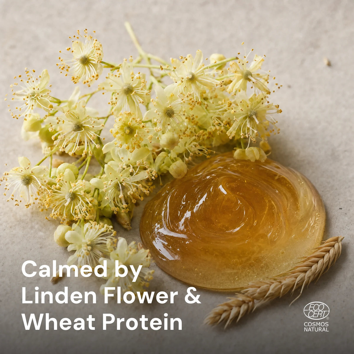 Linden flower cluster beside a glossy amber wheat protein droplet