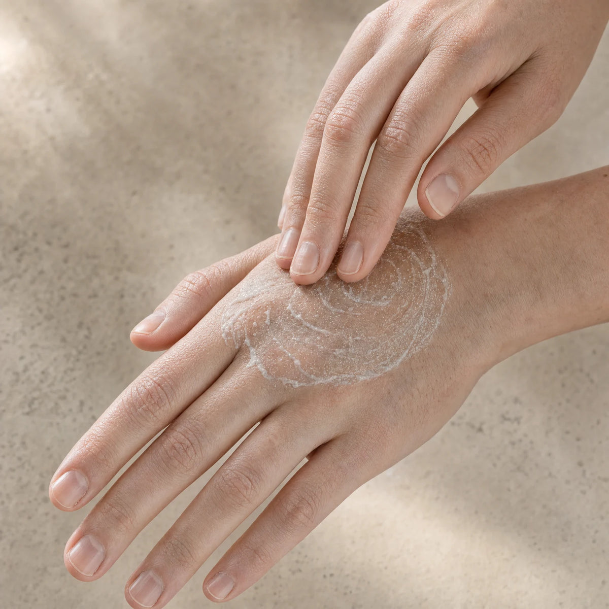 Applying Kojic Acid Face & Hand Polish to the back of the hand