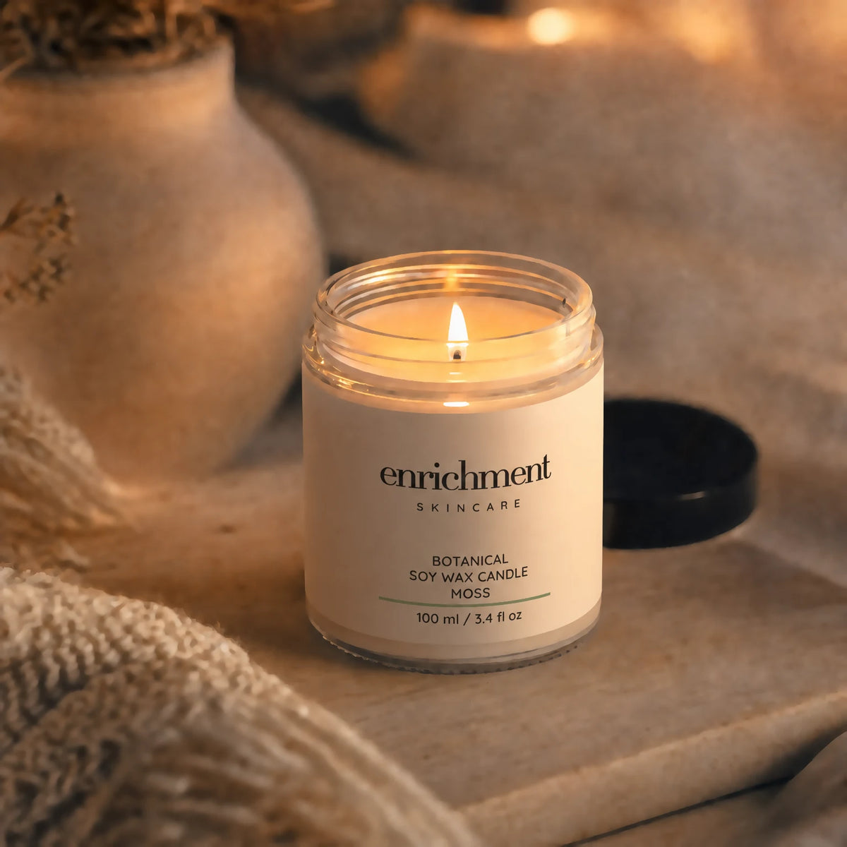 Enrichment Botanical Soy Wax Candle - Moss lit candle in a warm ambient setting