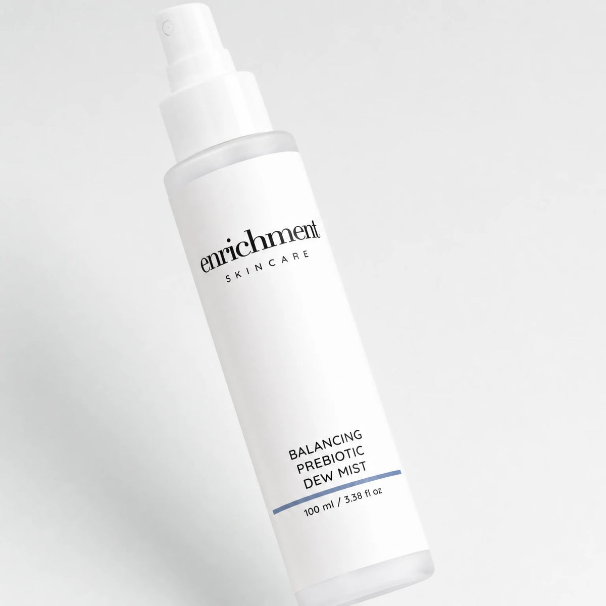 Enrichment Balancing Prebiotic Dew Mist bottle with the enrichment SKINCARE wordmark and 100 ml / 3.38 fl oz volume line centred on the label