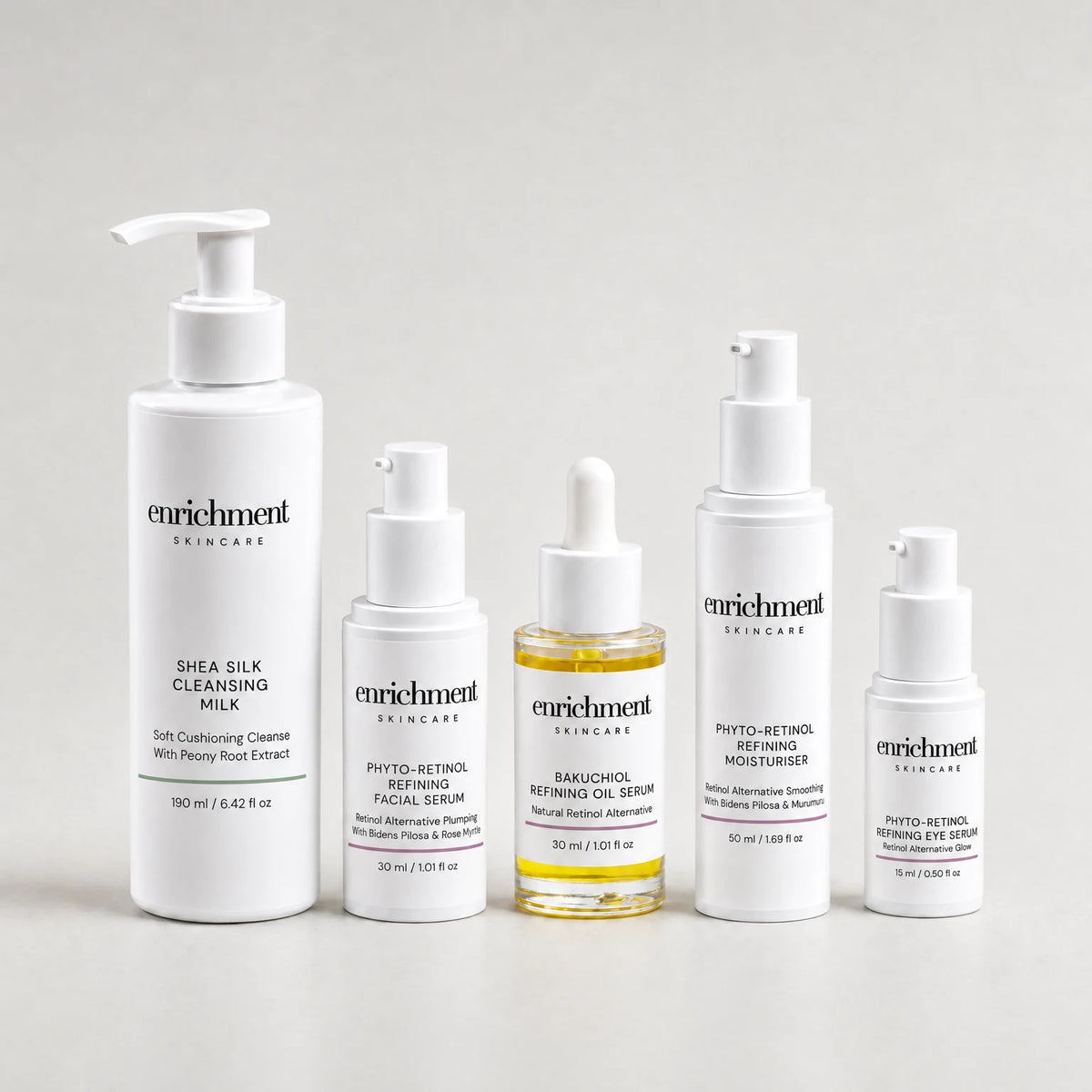 Five Enrichment Skincare products in a row: Shea Silk Cleansing Milk, Phyto-Retinol Refining Facial Serum, Bakuchiol Refining Oil Serum, Phyto-Retinol Refining Moisturiser and Phyto-Retinol Refining Eye Serum