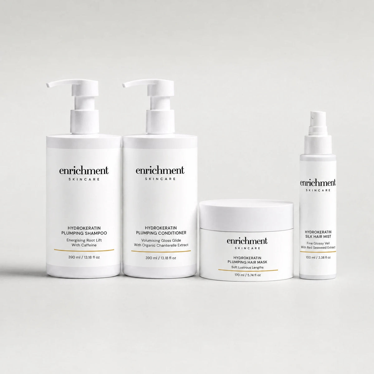Four Enrichment Skincare hair products in a row: Hydrokeratin Plumping Shampoo, Hydrokeratin Plumping Conditioner, Hydrokeratin Plumping Hair Mask and Hydrokeratin Silk Hair Mist