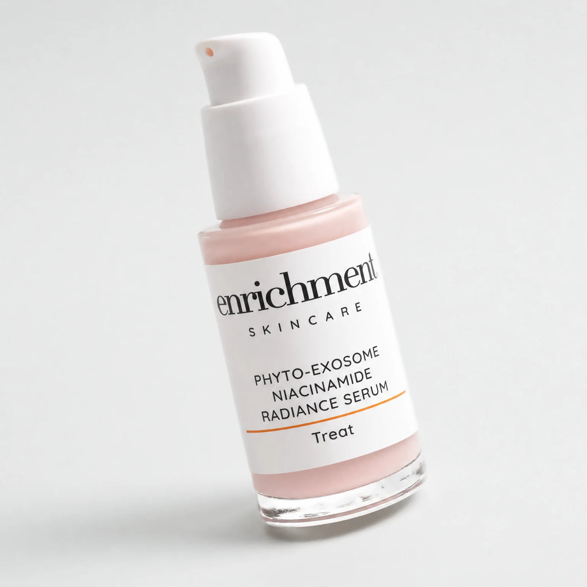 Angled close-up of the Phyto-Exosome Radiance Serum label and white airless pump